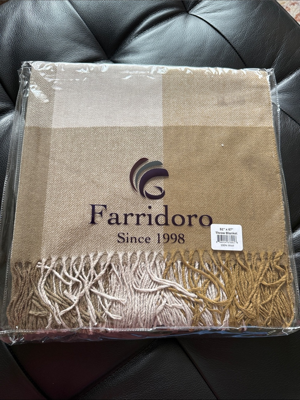 100% Wool Throw Blanket in soft neutral colors and fringes